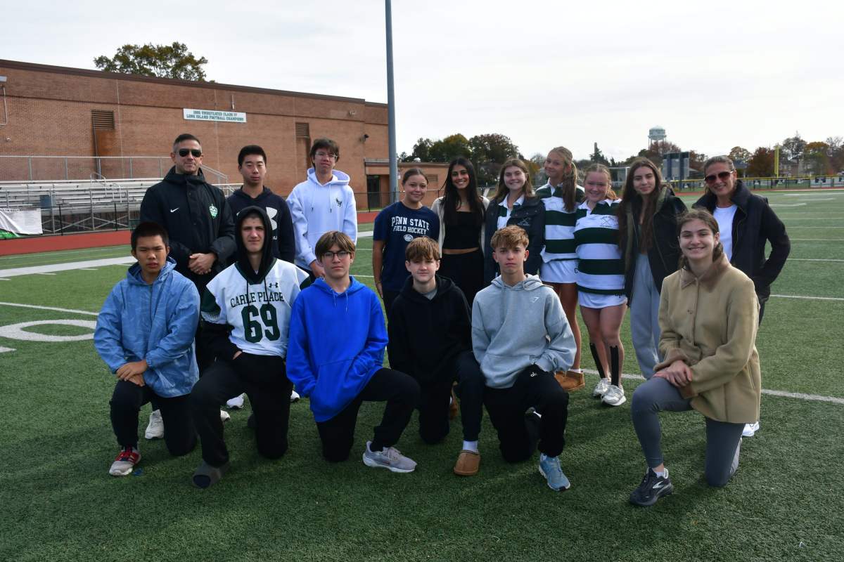 A group photo of Carle Place Middle/High School students and Athletic Director Justin Block.