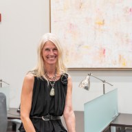 Long Island artist, Jennifer de Klaver, in front of her artwork for Daniel Gale Sotheby’s International Realty art exhibit, "Within Our Walls."