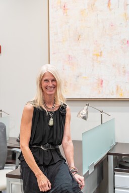 Long Island artist, Jennifer de Klaver, in front of her artwork for Daniel Gale Sotheby’s International Realty art exhibit, "Within Our Walls."