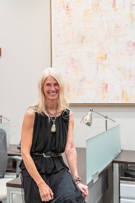 Long Island artist, Jennifer de Klaver, in front of her artwork for Daniel Gale Sotheby’s International Realty art exhibit, "Within Our Walls."