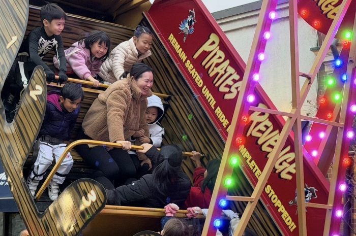 Attendees of all ages enjoyed a swinging carnival ride at the event.