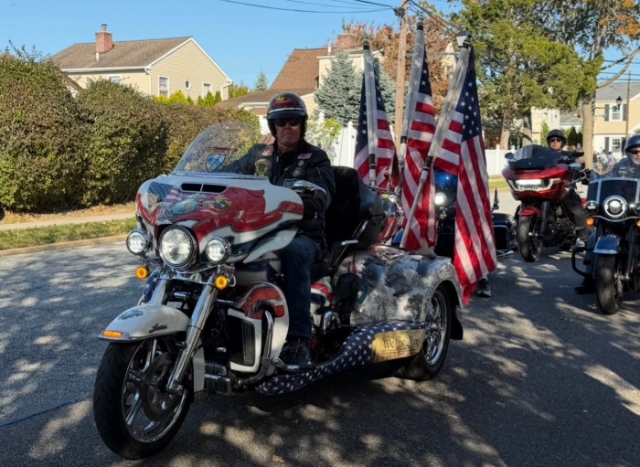 The parade honored a World War II veteran on his 105th birthday.
