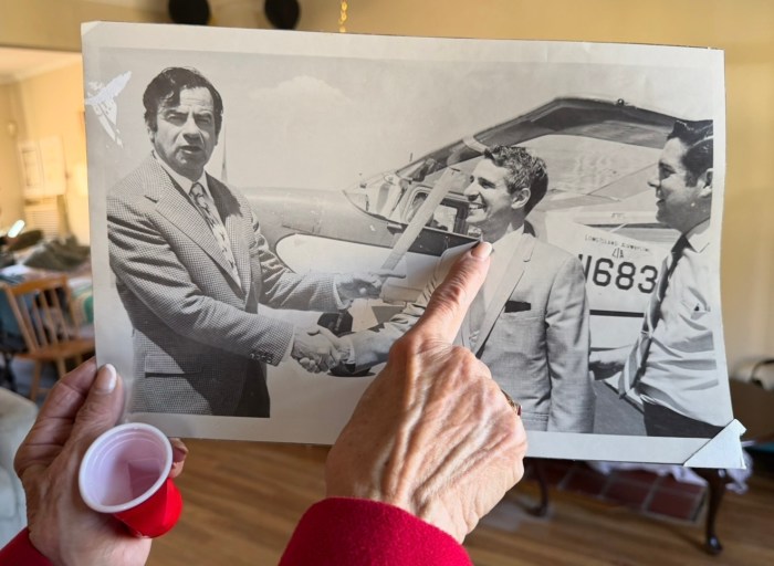 Connie Mceneaney points to Anthony Catalano in an old photograph.