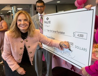 CEO of Rallye Motor Company Juliana Terian signed a check to New York Cancer Foundation for $4,000.