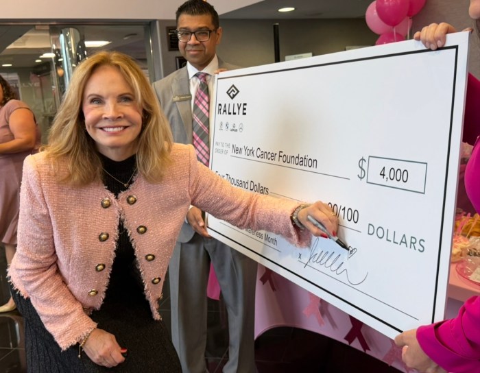 CEO of Rallye Motor Company Juliana Terian signed a check to New York Cancer Foundation for $4,000.