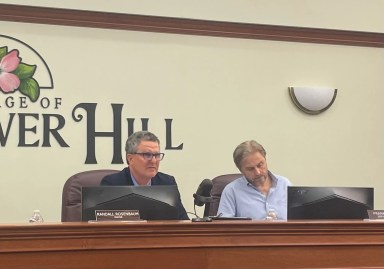 Village of Flower Hill Mayor, Randall Rosenbaum, and Deputy Mayor, Frank Genese, at their June board of trustees meeting.
