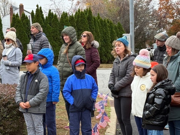 Multiple residents sang along to "God Bless America" during the ceremony.