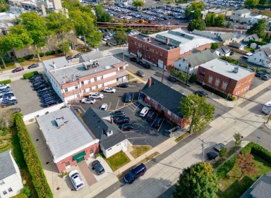 A three-building office portfolio in Manhasset sold for nearly $4 million to Mark Udell.