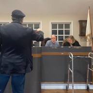 Boris Abdurakhmanov (L.), Deputy Mayor Marshall Bernstein (C.) and Trustee Marta Genovese (R.), discuss apartment plans at the November Village of Roslyn Board of Trustees meeting.