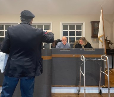 Boris Abdurakhmanov (L.), Deputy Mayor Marshall Bernstein (C.) and Trustee Marta Genovese (R.), discuss apartment plans at the November Village of Roslyn Board of Trustees meeting.