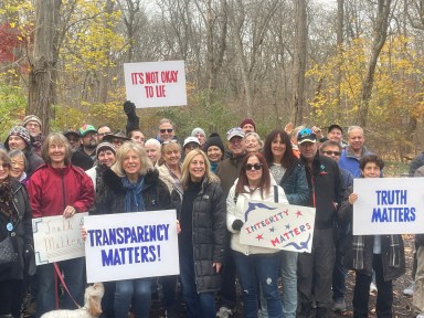 Great Neck residents gathered at Kings Point Park to protest a proposed private development that would turn parts of the park into a parking lot.