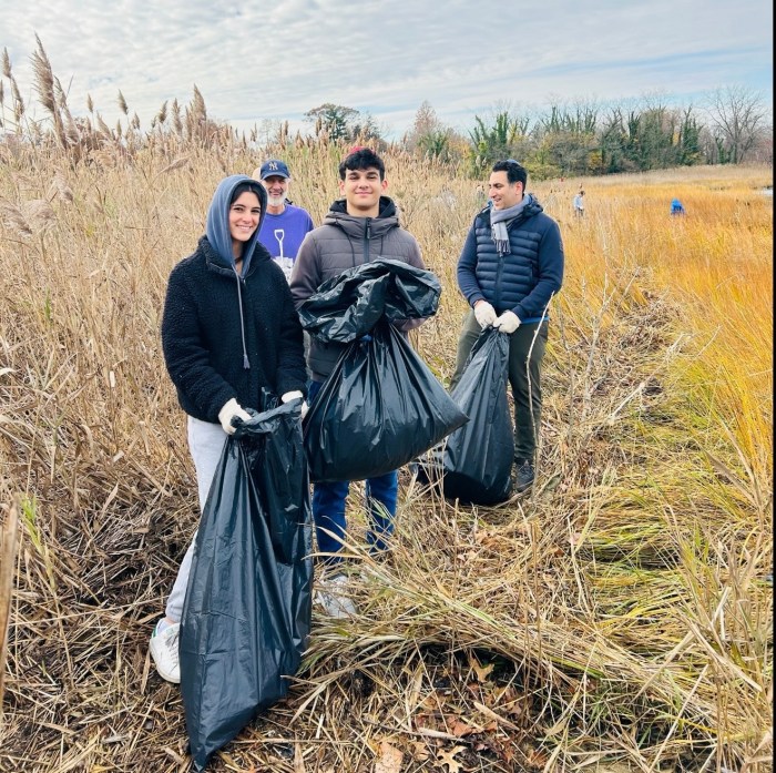 Over 50 people participated in a cleanup of Udalls Cove, according to high school junior Joseph Shemesh.