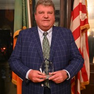 Arthur “A.J.” Smith with his IrishCentral Mentorship Award, recognizing his decades of leadership and guidance.