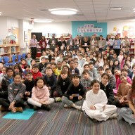 Principal Ron Gimondo and library media specialist Erin Vargo joined fifth grade students and their teachers during a visit from guest author Jen Calonita in the JFK library.