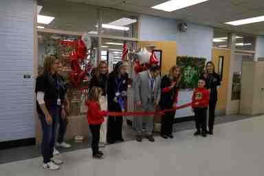 Students Kate Bennett and Easton Sewitch helped cut the ribbon.