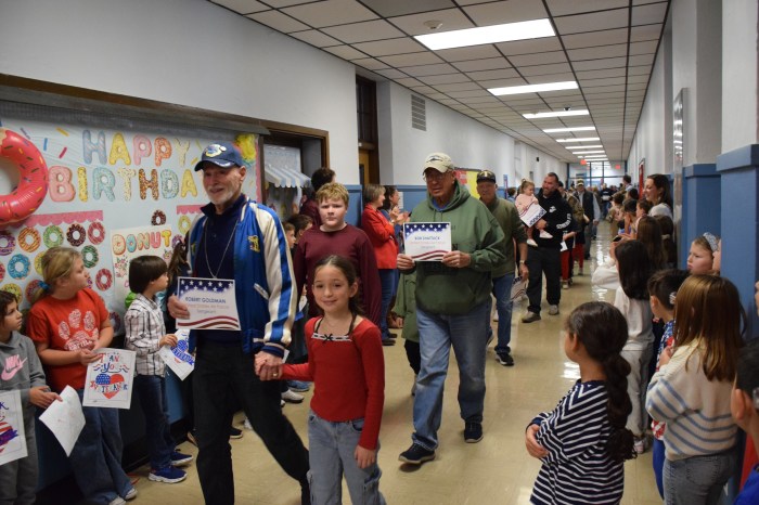 Fairfield Elementary School students marched down the hallway with veterans theyknow for the third annual Heroes Charge.