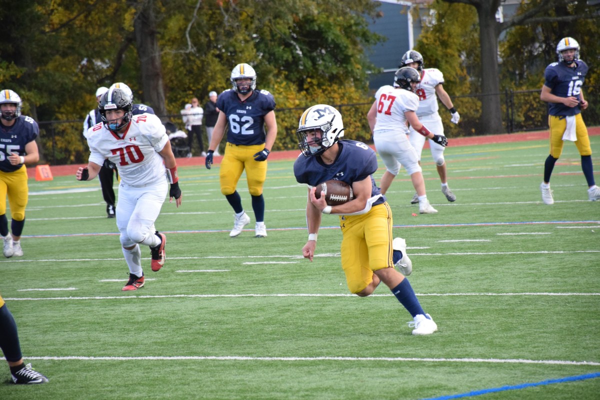 Andrew Pedalino gained yards during Massapequa High School’s homecoming game, a 42-7 victory over Syosset.
