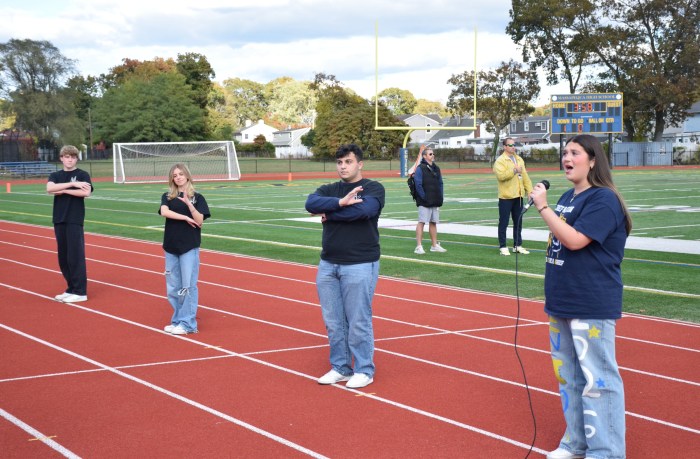Angelina Biondi sang the national anthem while joined by students from American Sign Language classes.