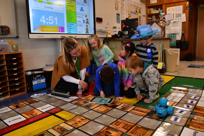 Students and their teacher coded a robot.