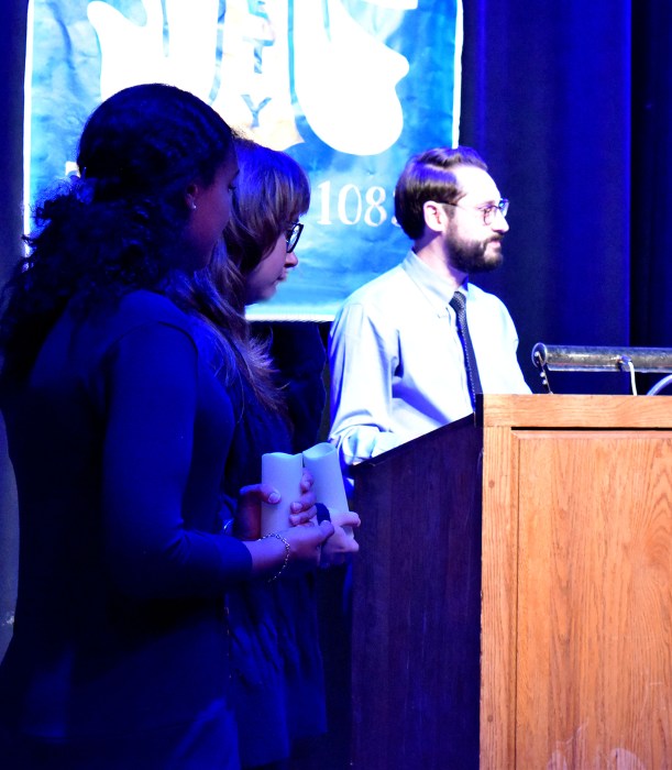 Aaron Brateman with North Shore High School inductees, speaking at the event. 