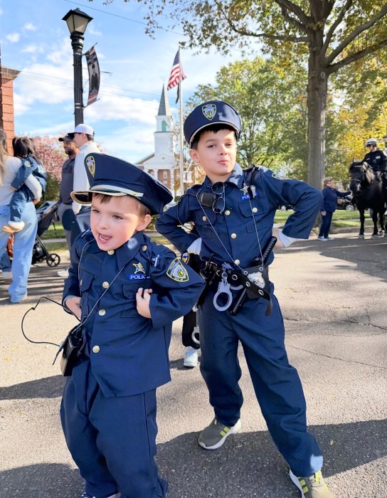 Police dispatcher Meghan Clark's sons Lucas and Dylan wore police uniforms to the Halloween event.