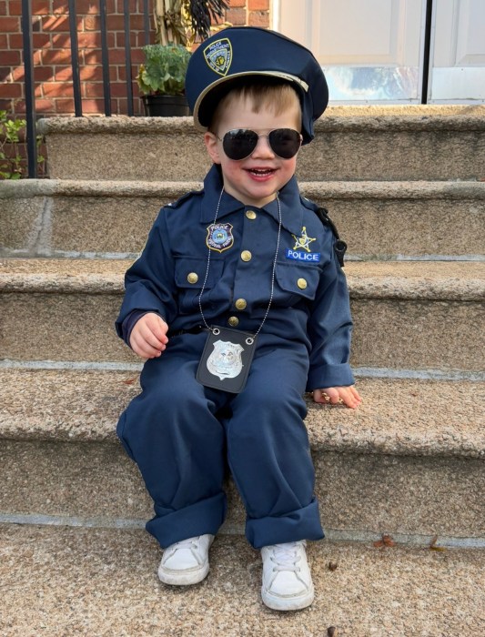 Attendee Connor posed in his police uniform at the Halloween event. 