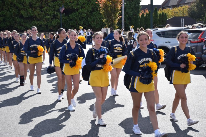The cheerleaders arrived at the high school.
