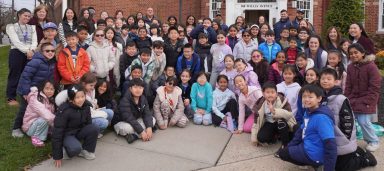 Herricks students from Searingtown Elementary, Denton Avenue and Herricks Middle School, with help from the district’s transportation department, deliver food donations to St. Aidan's Food Bank.