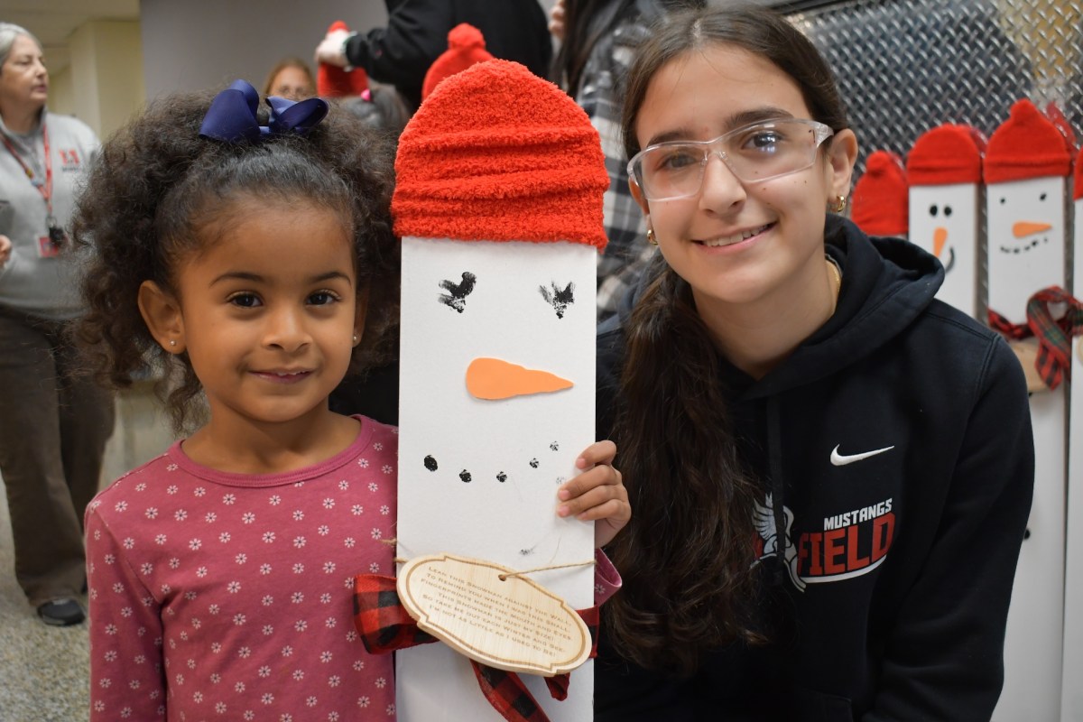 Mineola High School hosted kindergartners from Hampton Street School on Dec. 11 for the annual holiday snowman project, a favorite activity for learners of all ages.
