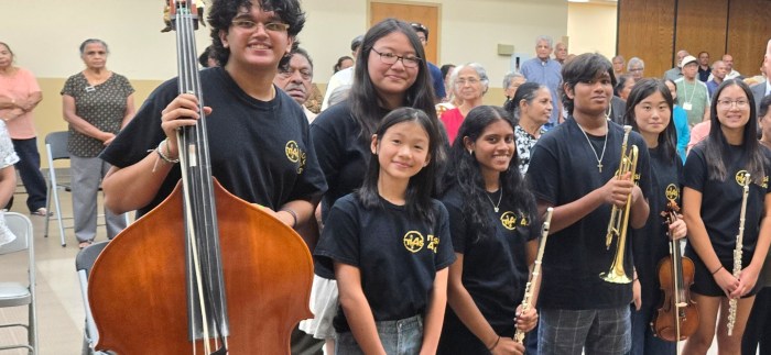 Gabriella Mathew (holding flute) with other Music 4 Souls members