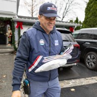 Port Washington Letter Carrier Richard Morales delivering mail during the holiday season.