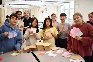 Seventh and eighth grade members of Mineola’s National Junior Art Honor Society gathered recently to design and assemble handcrafted greeting card kits that will be sold to benefit local food pantries.