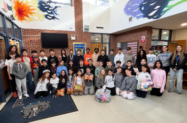 Roslyn Middle School students and teachers with their treats and toys.