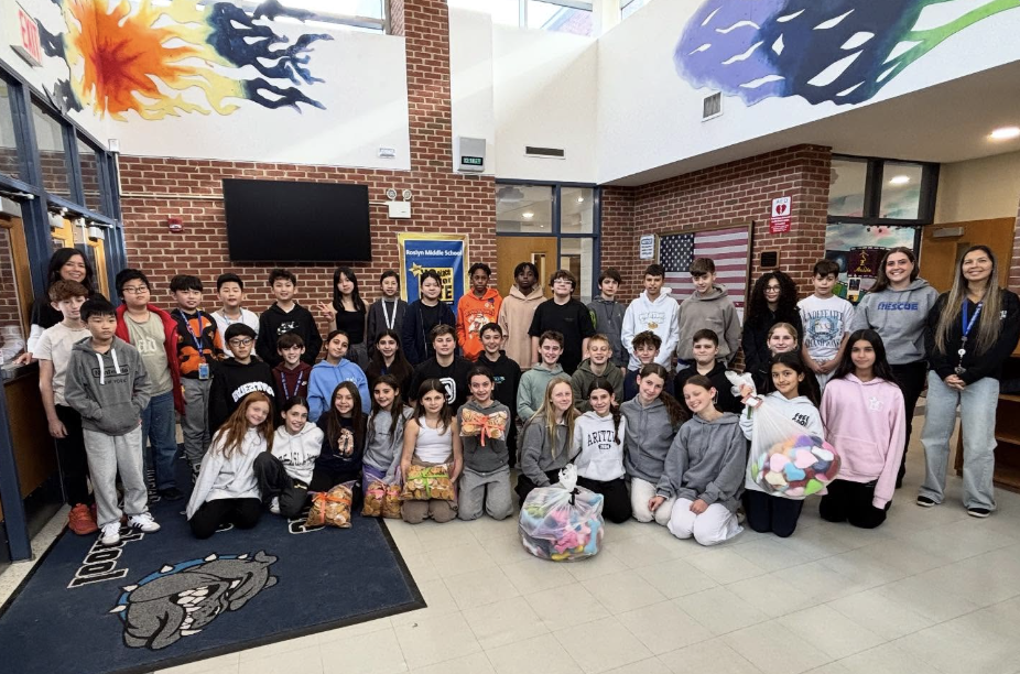Roslyn Middle School students and teachers with their treats and toys.