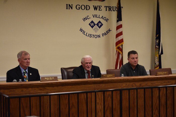 Village officials at the recent Board of Trustees meeting