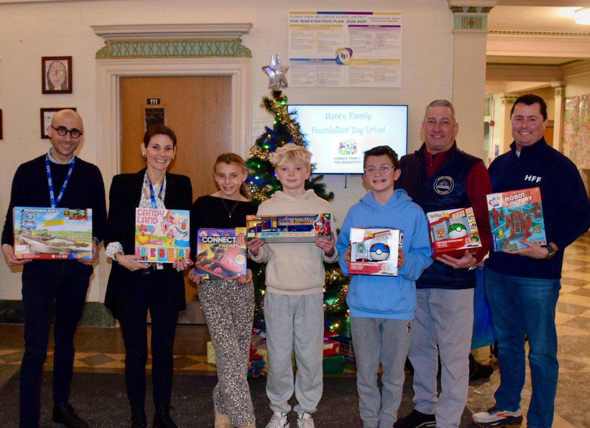 Floral Park-Bellerose School Assistant Principal Michael Elka, Principal Lauren Quezada and Student Council officers are pictured with Hance Family Foundation Founder/Co-President Warren J. Hance Jr. and Executive Director Tom Cannon on Dec. 15.