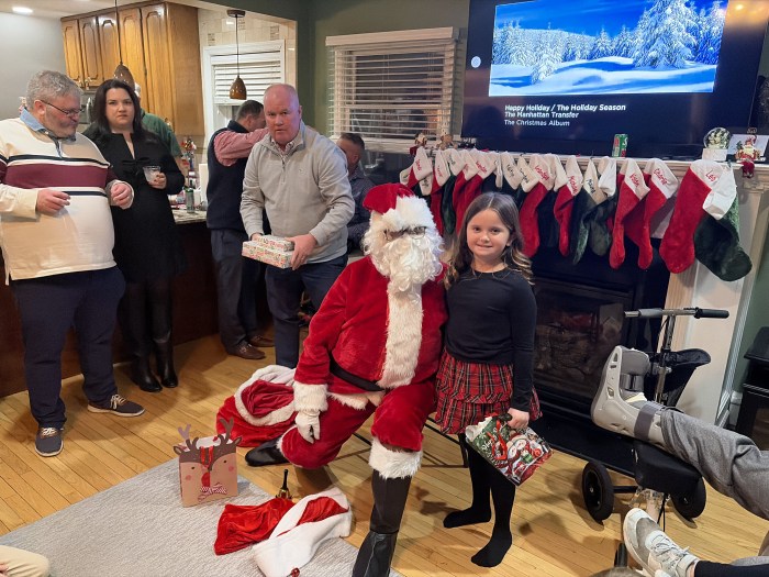 Santa gave gifts to each of the children.