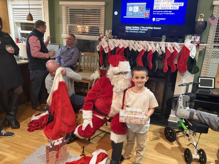 Santa's visit on Christmas Eve brought joy to the whole family. 