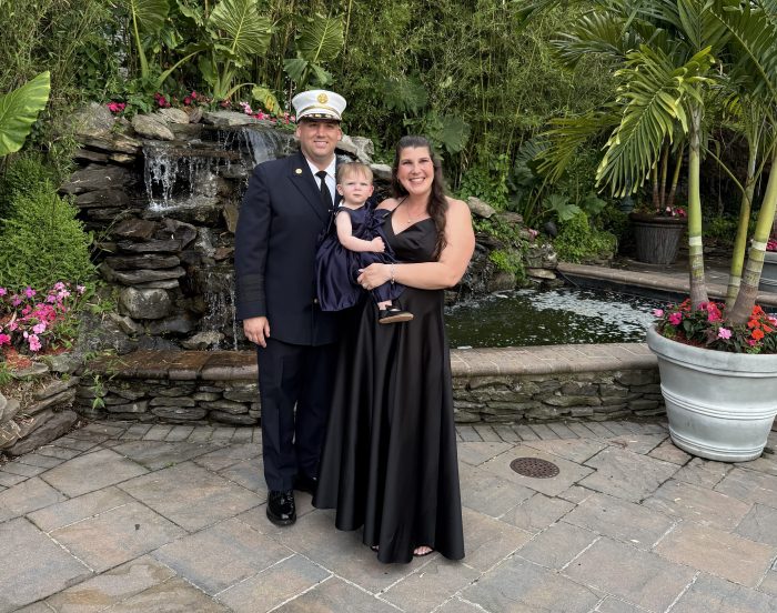 Fire Chief Strauss with his wife, Lia, and their child, Ariana. 
