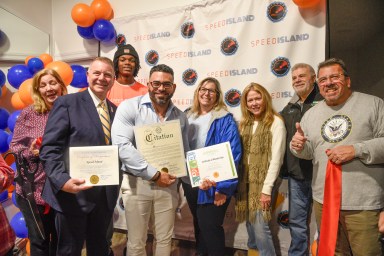 Onix Salva (fourth from L.) celebrated the official opening of Speed Island in Farmingdale with a ribbon-cutting ceremony.