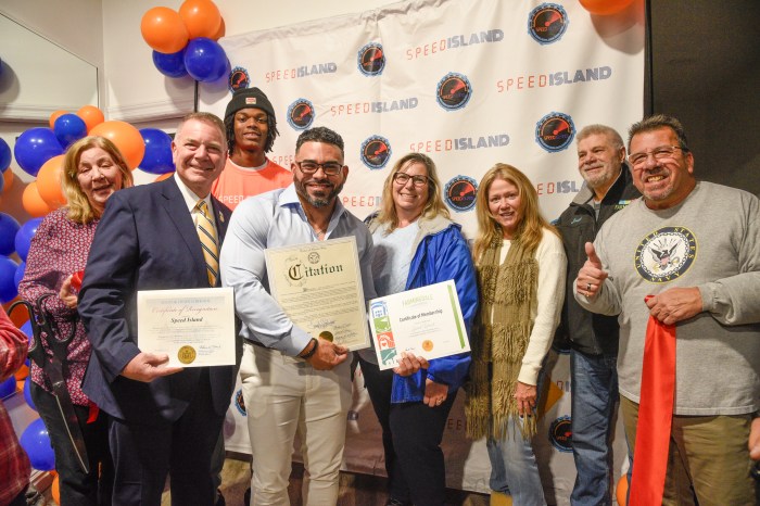 Onix Salva (fourth from L.) celebrated the official opening of Speed Island in Farmingdale with a ribbon-cutting ceremony.