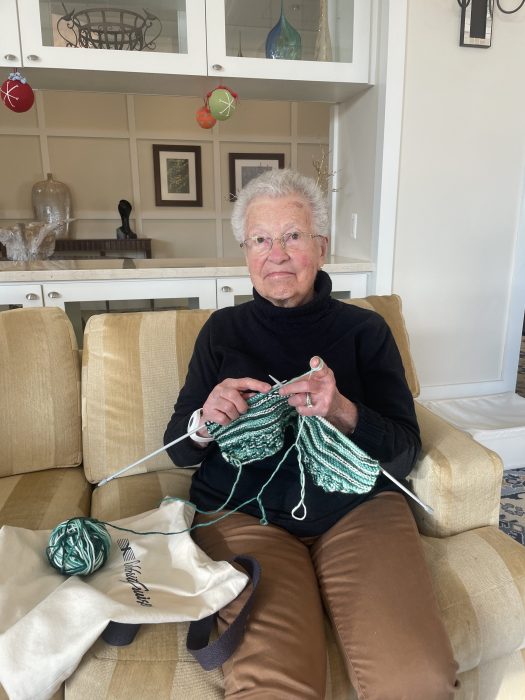 Marilyn Bromley knitting a 'magic hat.'