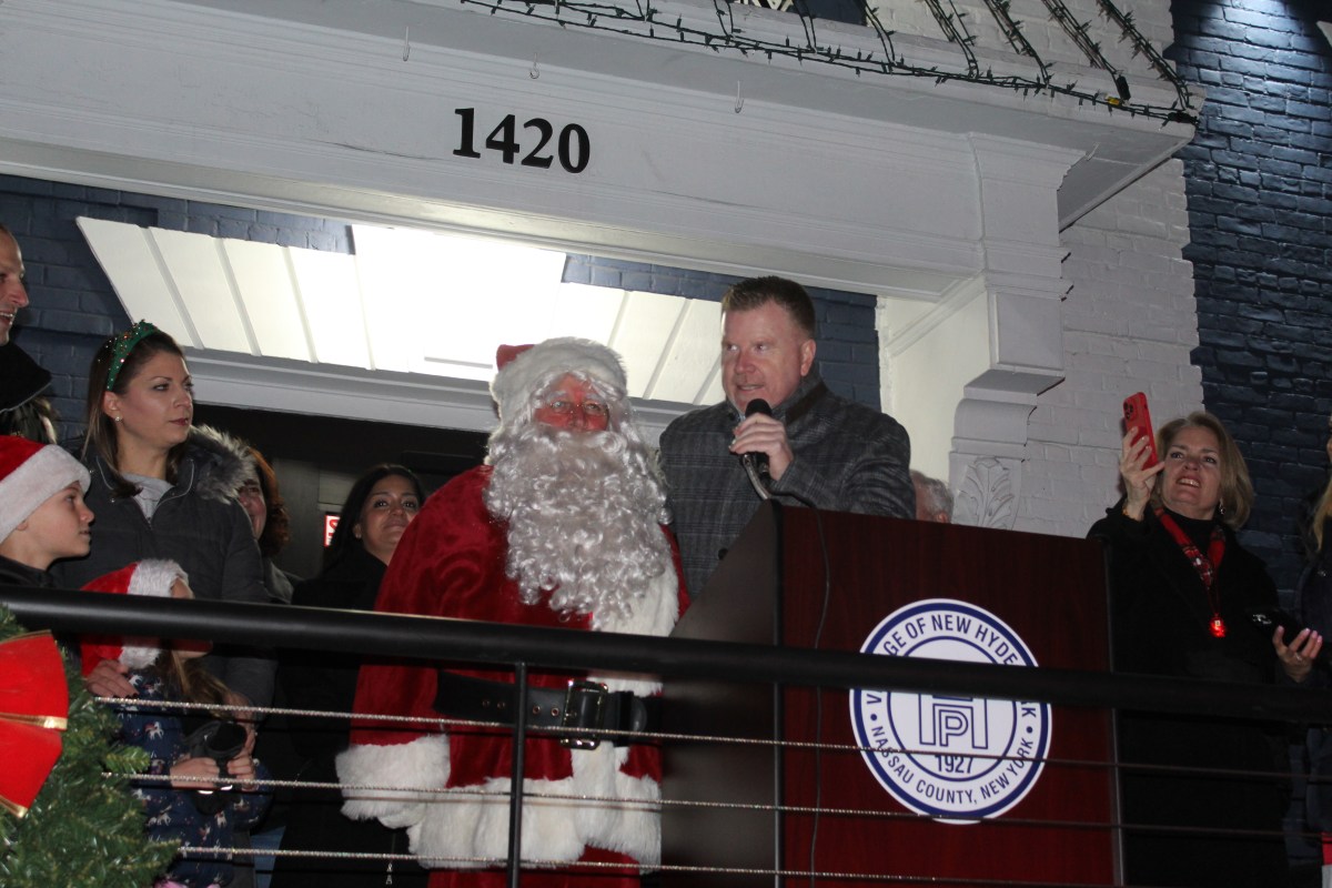 Santa Claus and New Hyde Park Mayor Christopher Devane count down to village hall tree lighting ceremony.