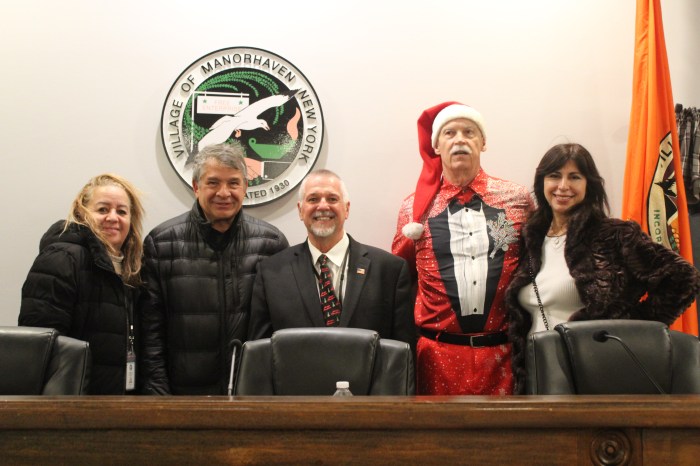The Village of Manorhaven Board of Trustees celebrated the holiday season with a tree and menorah lighting.