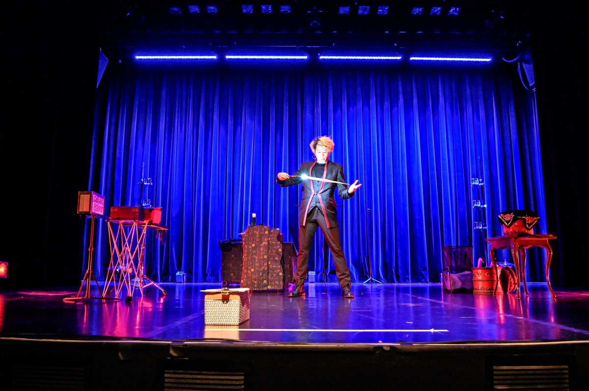Magic Q, the Shanghai-born magician, showing his tricks to the audience