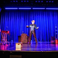 Magic Q, the Shanghai-born magician, showing his tricks to the audience