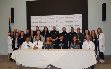 Francesco Allocca (C.) and the community members and medical professionals who helped him recover.