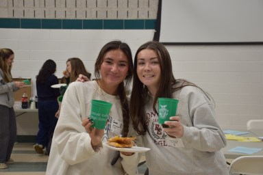 Locust Valley High School alumnae Sienna Singe (L.) and Grace O’Mahony (R.) reconnect at the IB alumni event