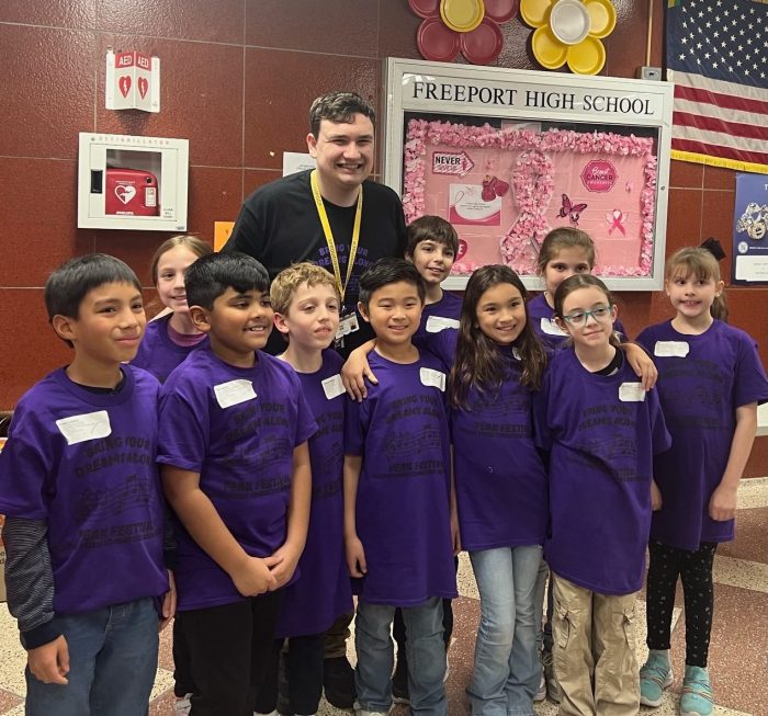 Music teacher Calob Congdon is pictured with the PEAK students from Garden City Park School and New Hyde Park Road School.
