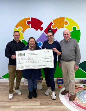 Sofia Kokkoris-Christakis, owner of Puzzles, accepts grant awards for new tenant and new sign from Port Washington BID Board members, Michael Tretola, Council Member Mariann Dalimonte, and Bill Haagenson.